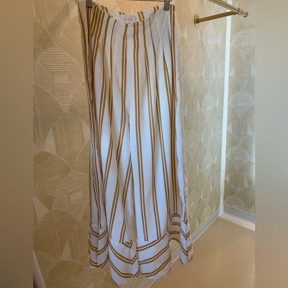 Anthropologie Sancia Violeta ruffle wide leg pants. White with gold strips.